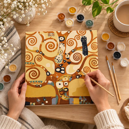 Tree of Life paint by numbers kit being painted with wooden brush and acrylic paints