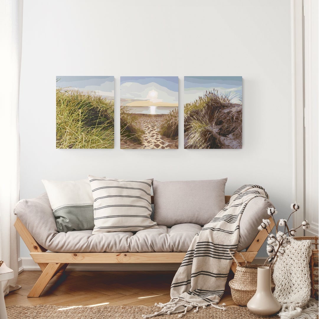Finished Beach triptych above a neutral sofa. Display idea; the kit contains rolled, unframed canvases.