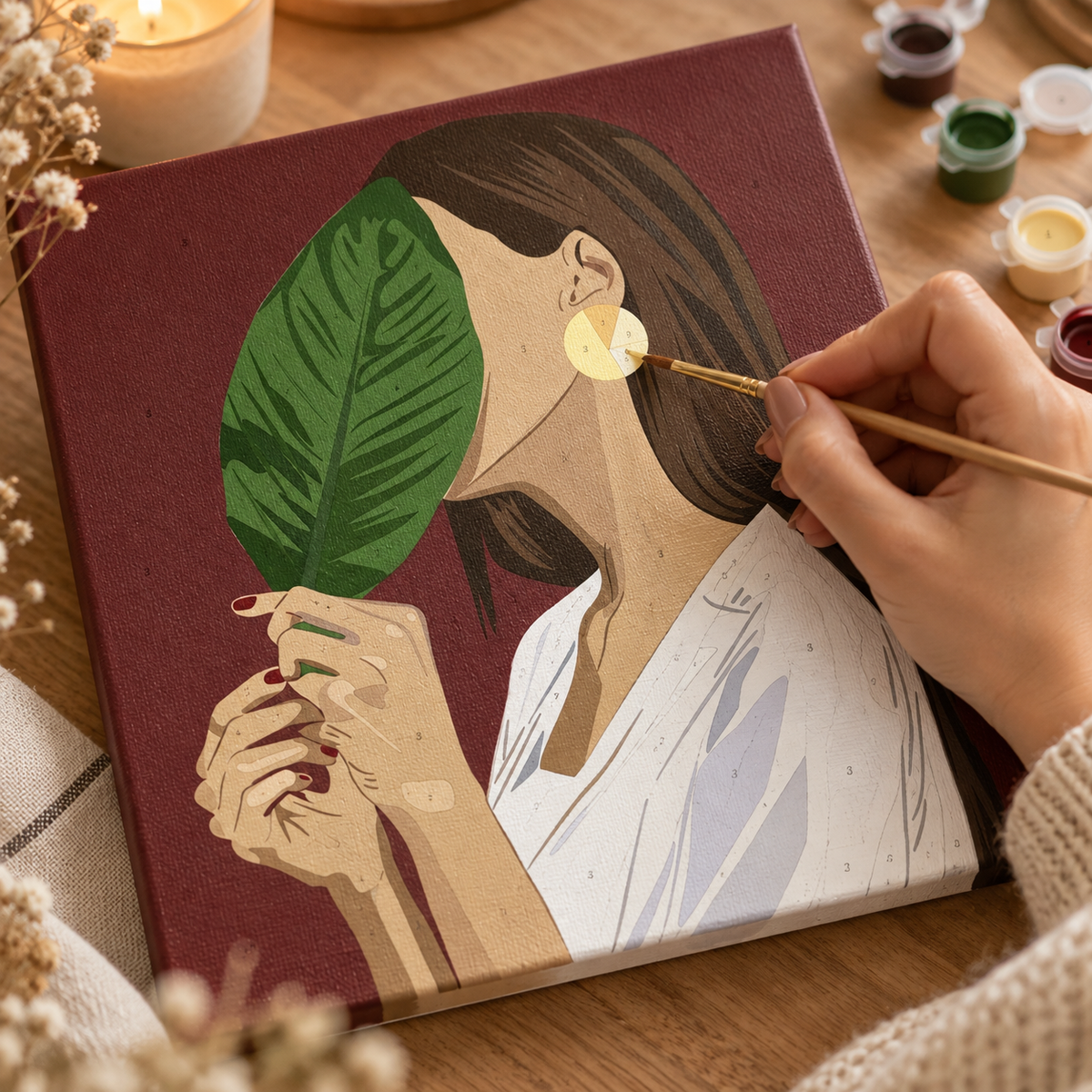 Botanical Woman paint by numbers canvas being painted by hand with numbered acrylic paints