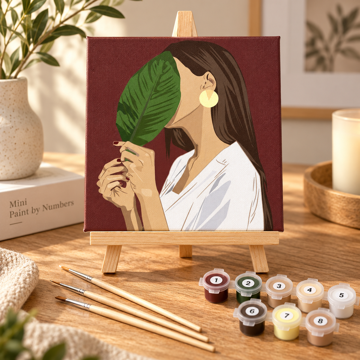 Botanical Woman paint by numbers kit on a wooden easel with paints and wooden brushes