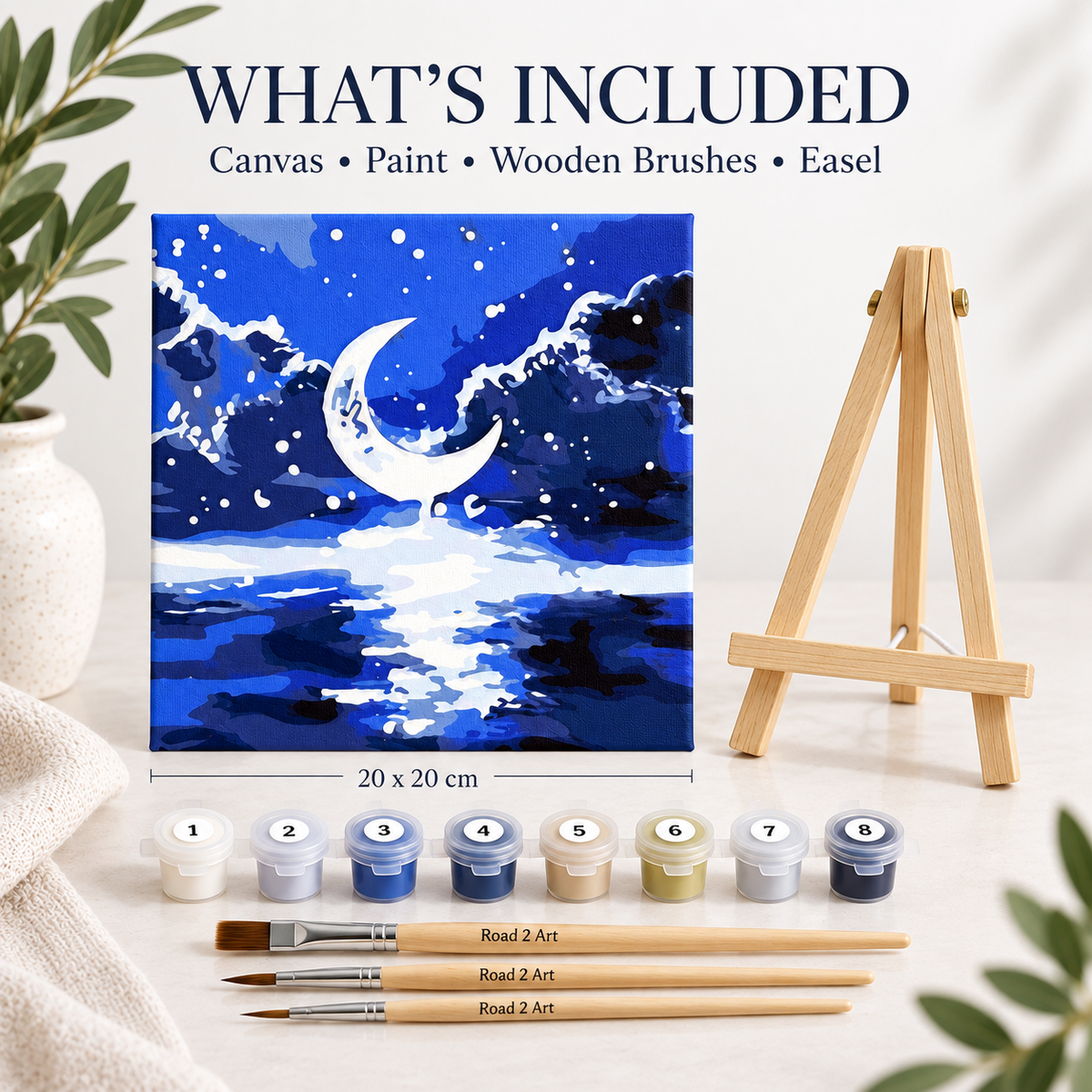 Mini paint by numbers kit with easel showing Midnight Moon canvas, numbered paints and wooden brushes
