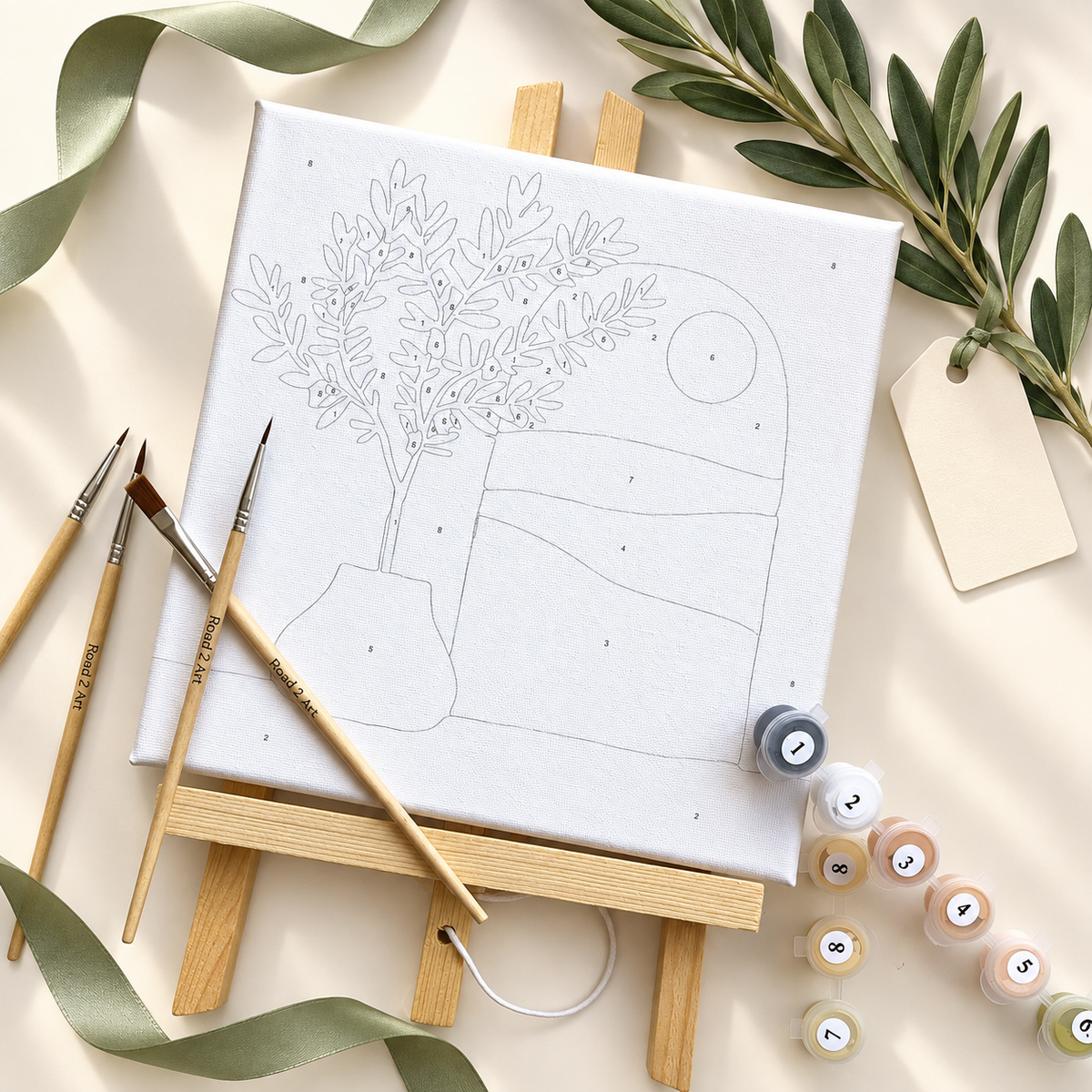 Complete Olive Tree mini paint by numbers kit flat lay showing the 20 x 20 cm framed canvas, numbered paints, brushes and wooden easel