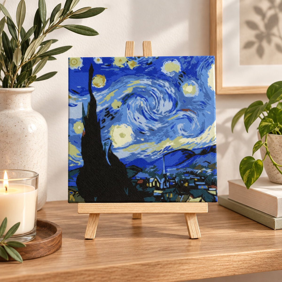 Finished Starry Night paint by numbers artwork displayed on a small wooden tabletop easel